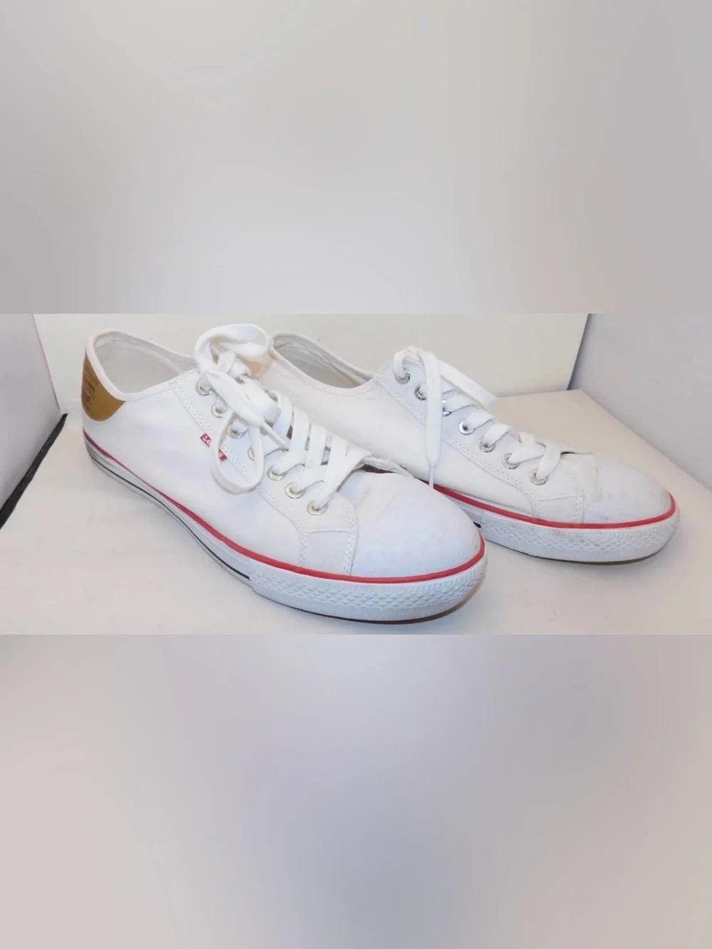 Levi's White Low-Top Sneakers with Red Stripe and Tan Heel Patch